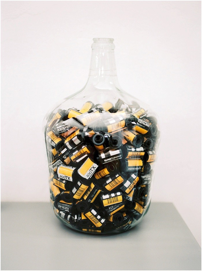 Jar of 35mm film rolls by Fiona Caroline Photography