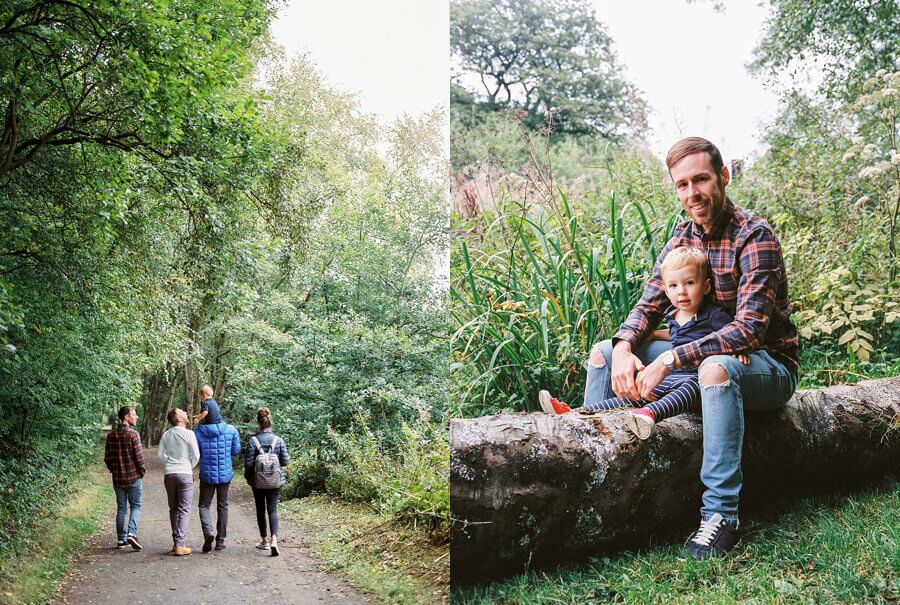 Picture of family walking in to the woods and adult and child relaxing on a felled tree trunk in the woods | Family Woodland Shoot