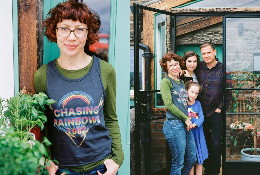 Family Portraits stood outside their home by an open door | Colour family photography