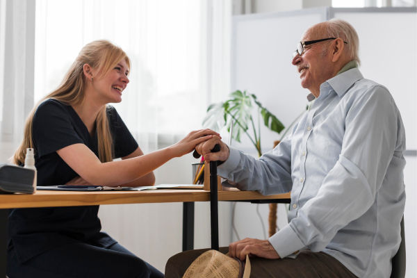 smiley-senior-man-conversing-with-nurse 1 (1)