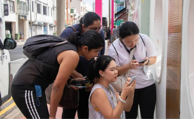amazing race team building activity in singapore with teams solving challenges together