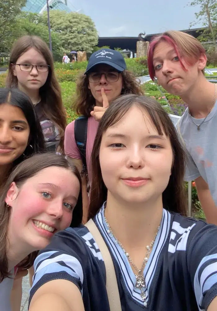 groups of students completing an amazing race station as a team building activity