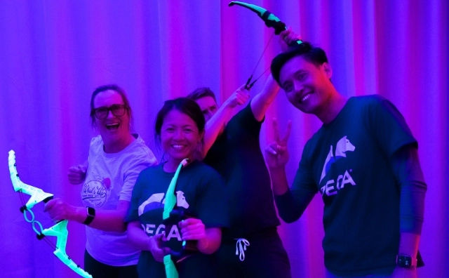 Team Building Singapore corporate clients playing neon archery tag in singapore