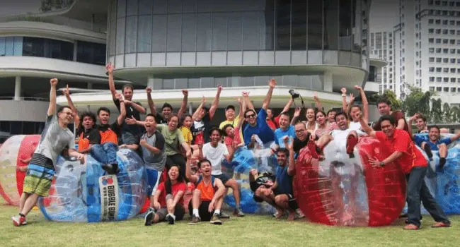 bubble soccer for team building with adults playing as a team