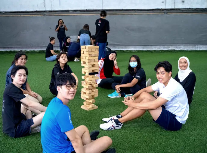 clients playing giant jenga - giant board games