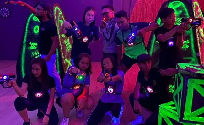 group of friends in a game of laser tag