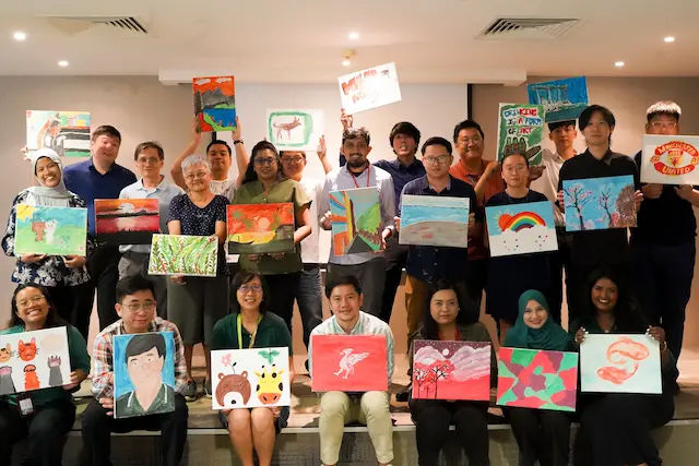 participants in an art jamming workshop by Team Building Activities Singapore
