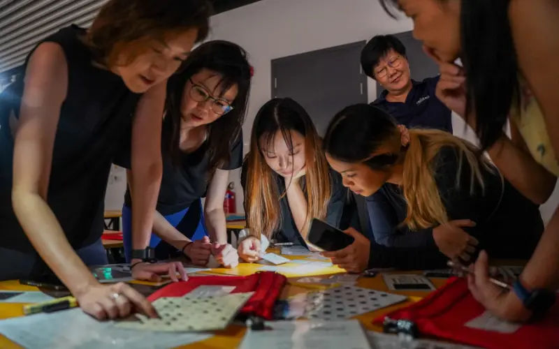 team building activities for students solving a puzzle together as a team