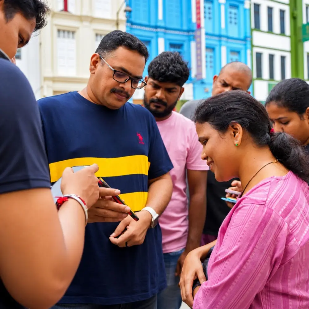 A team gathers round a phone to read the next mission