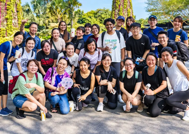 A big team pose together under the Supertrees at Gardens by the Bay