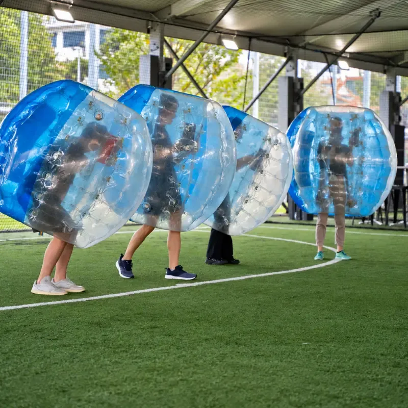 Players mid-round in their bubble suits