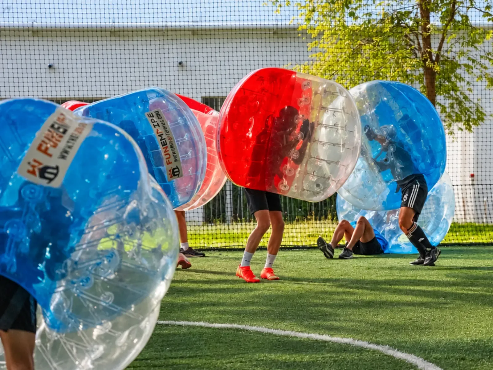 A player is knocked off their feet during an outdoor round