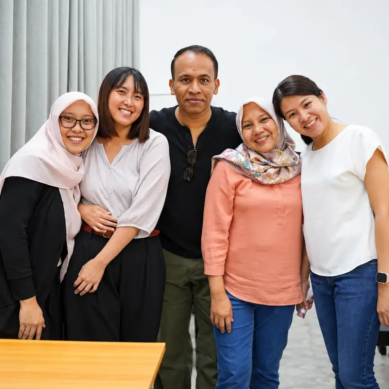 Five friends pose together after their escape puzzle session