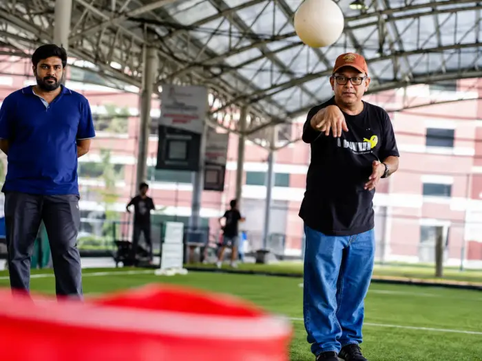 A group plays out on a sheltered outdoor pitch
