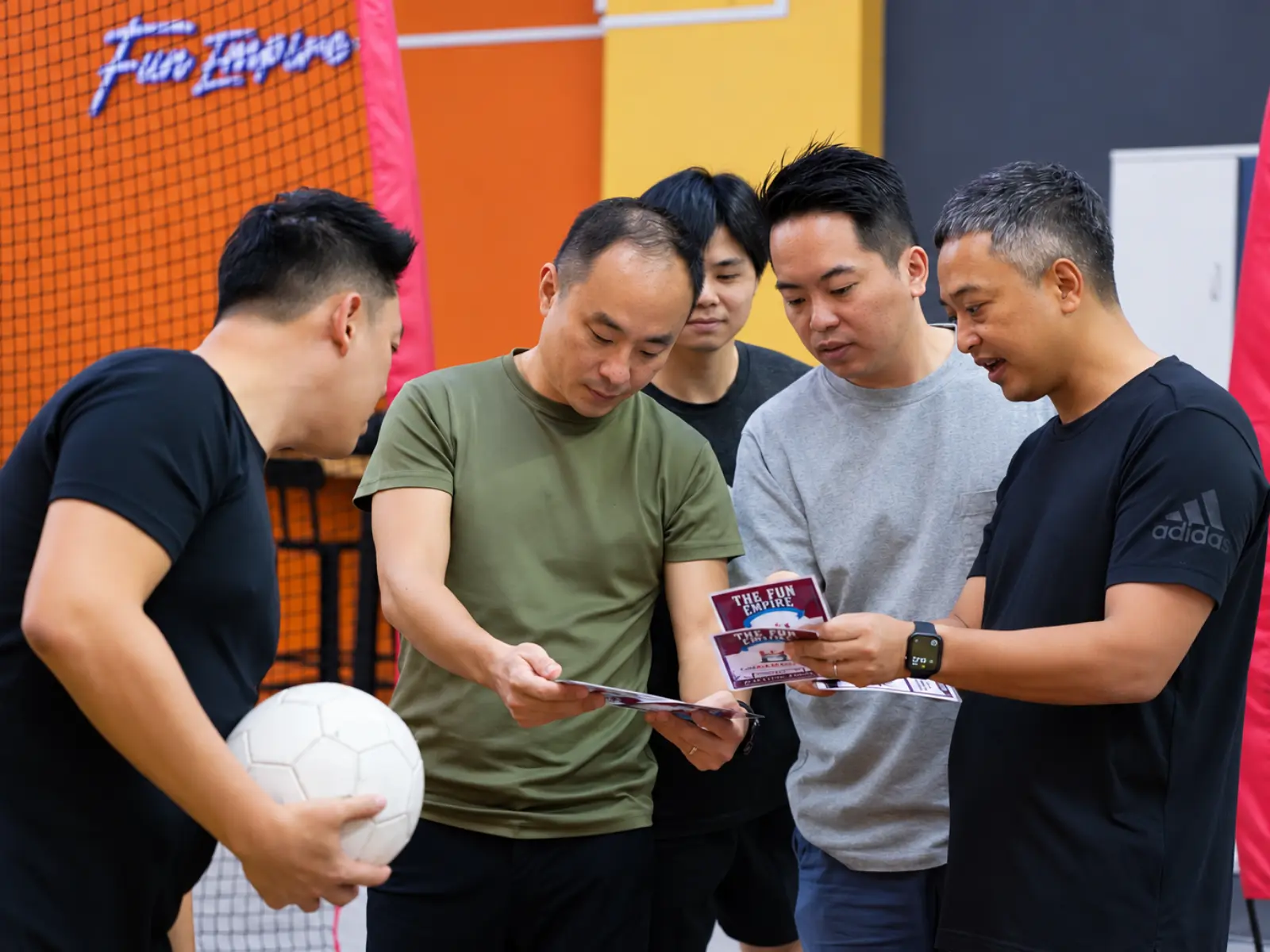Players check the game card between shots