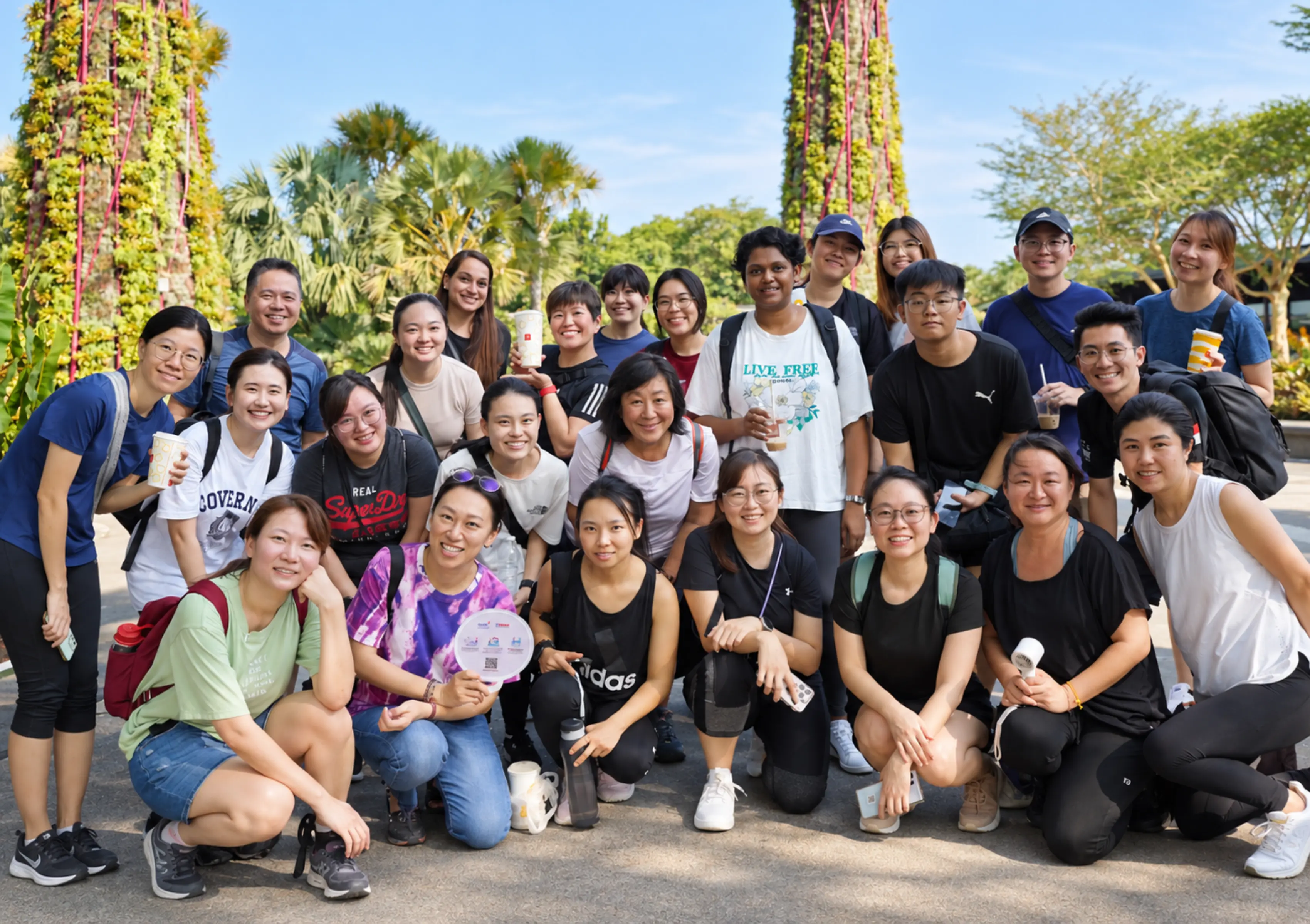 A large team gathered outdoors during an Amazing Race event