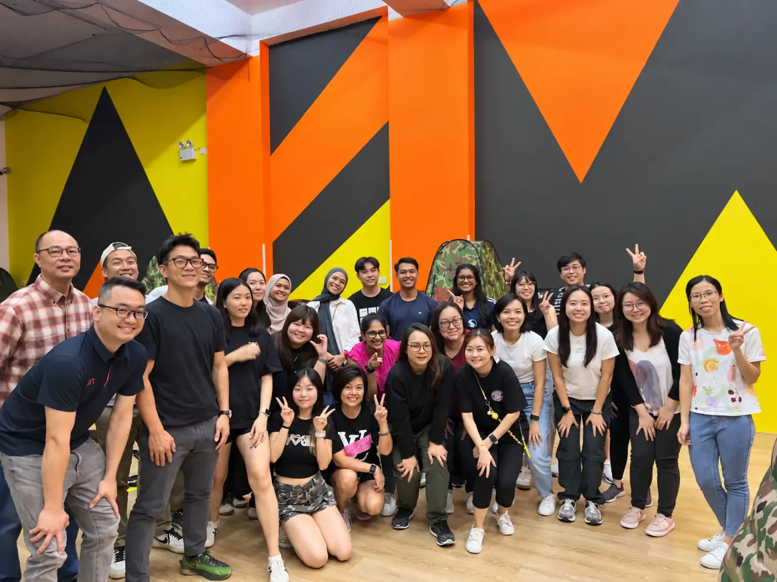 Colleagues celebrating together during a corporate team building session