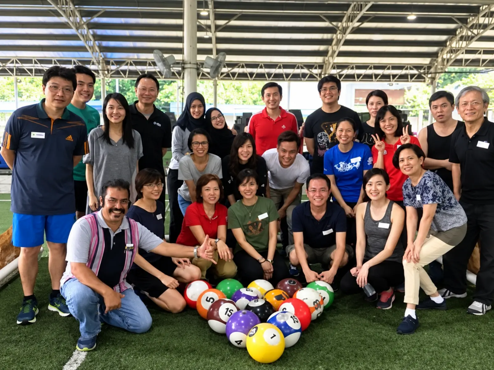 IMDA staff with Poolball balls after their team building day