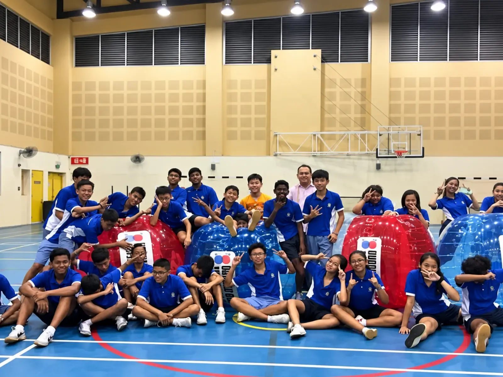Commonwealth Secondary students play Bubble Soccer in the school hall