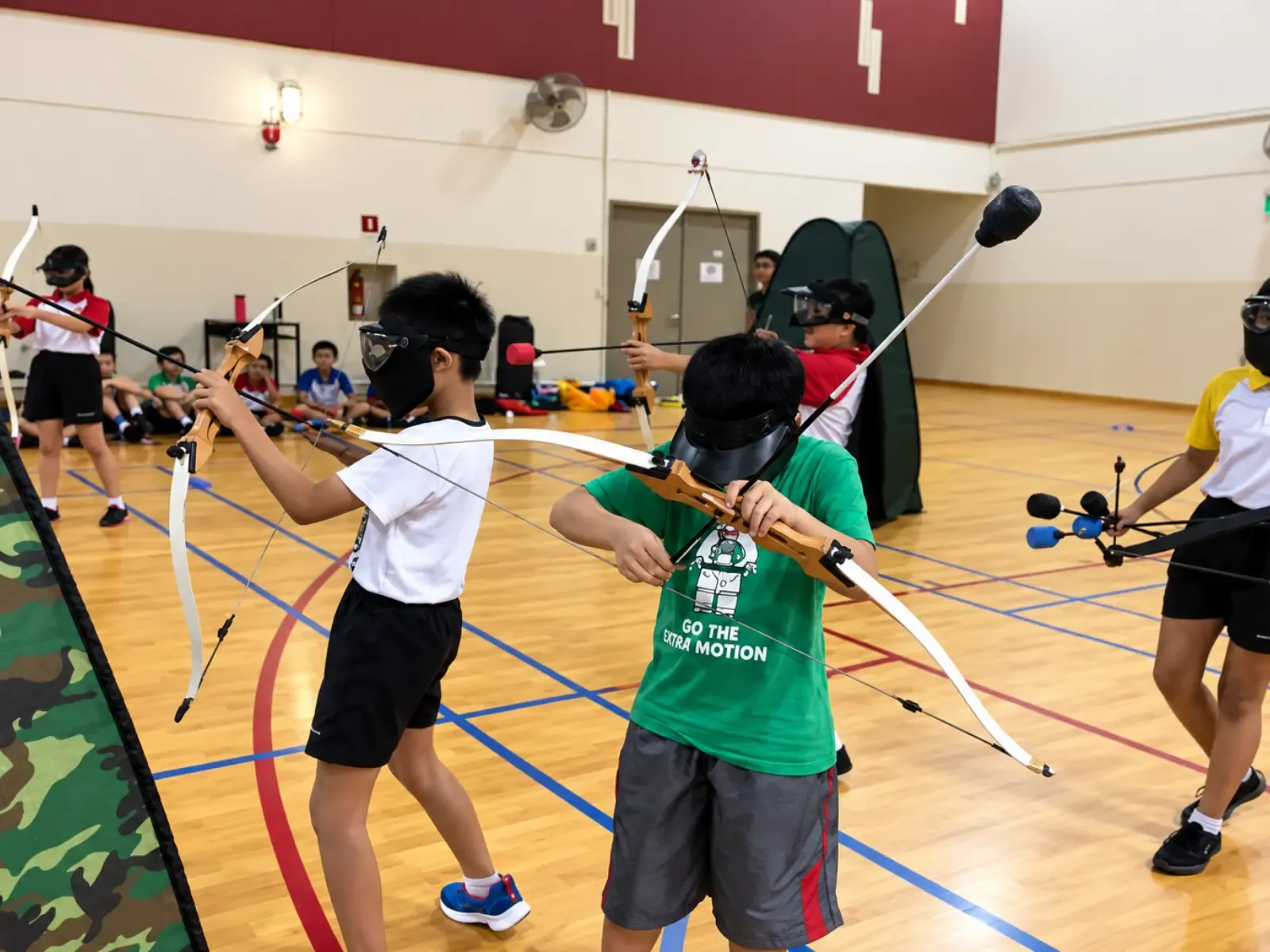 Bendemeer Primary pupils gather after Combat Archery Tag in the school hall