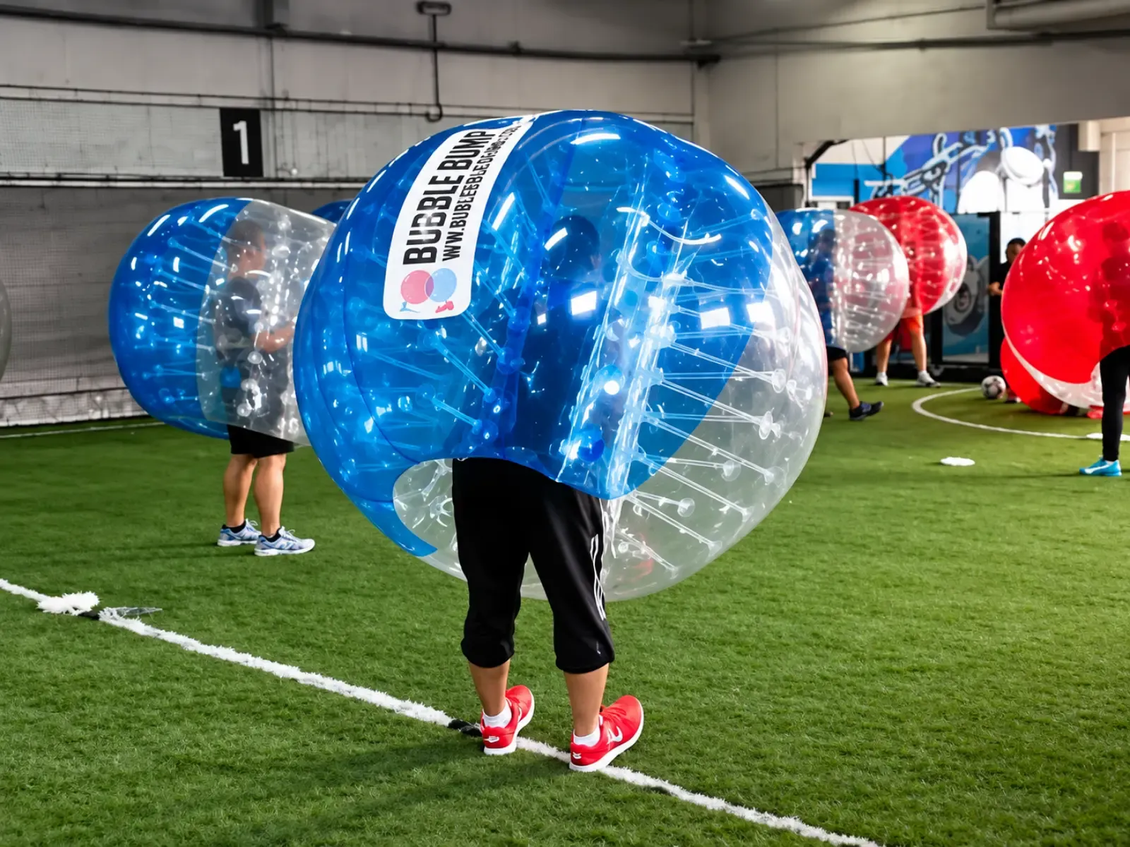 Officers line up in Bubble Soccer suits