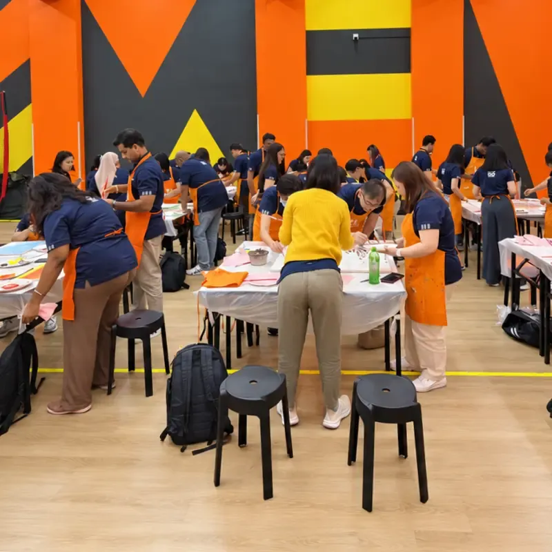 Art Jamming stations set up in a school hall for a staff bonding day