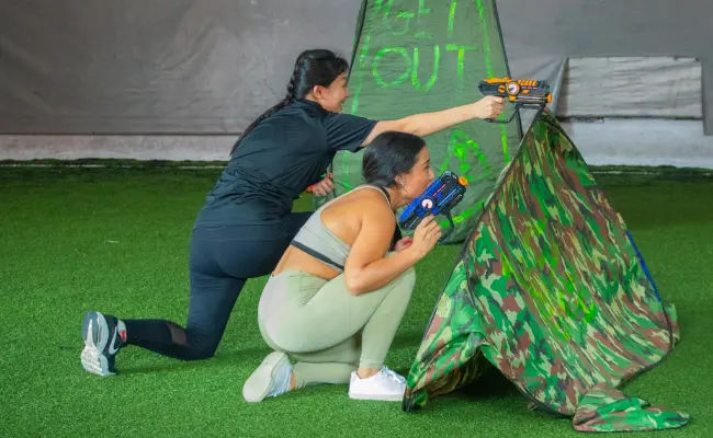 players moving together in a game of laser tag in singapore
