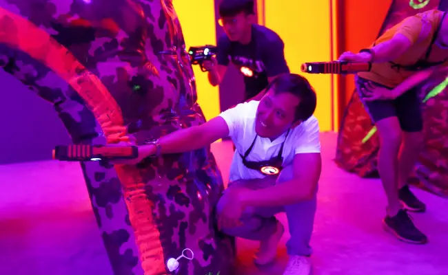 players crouching in a game of laser tag in singapore