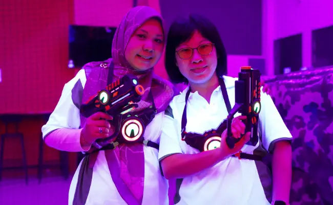 happy clients in a game of laser tag / laser quest singapore