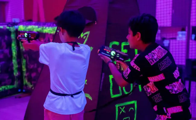 kids playing laser tag as a bonding game in singapore