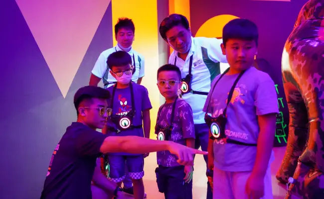 facilitator guiding students before a bonding game in singapore