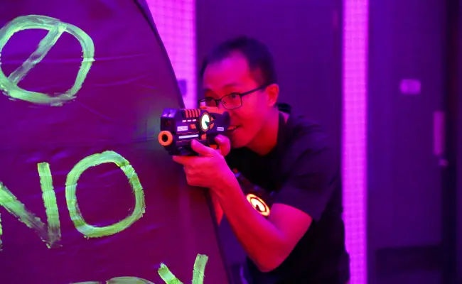 player aiming in a game of laser tag in singapore 