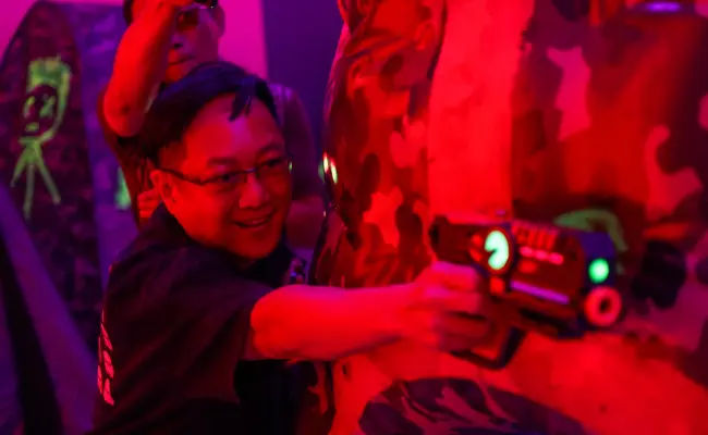 player taking aim in a game of laser tag in singapore