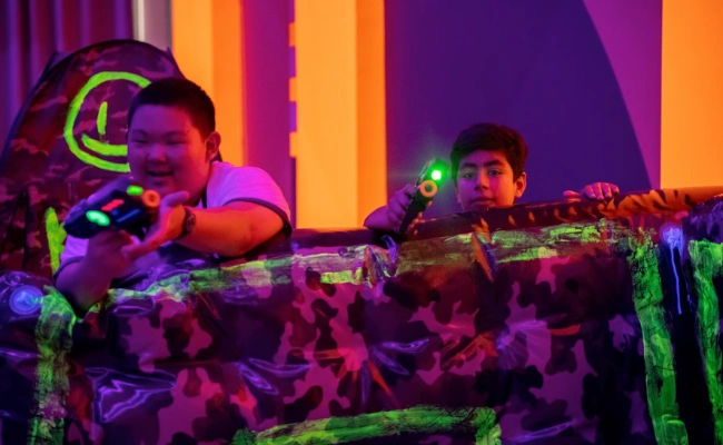students playing laser tag as a bonding game in singapore