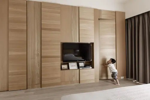 Hidden Door Beside TV Wall - Concealed Door Singapore (Credit: Pinterest)