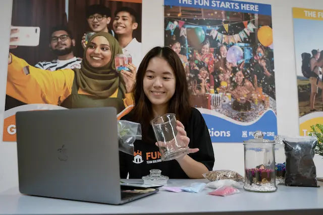 a facilitator teaching online clients how to make and maintain a terrarium in singapore