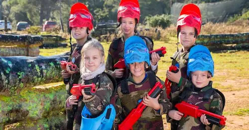 young participants in a paintball session