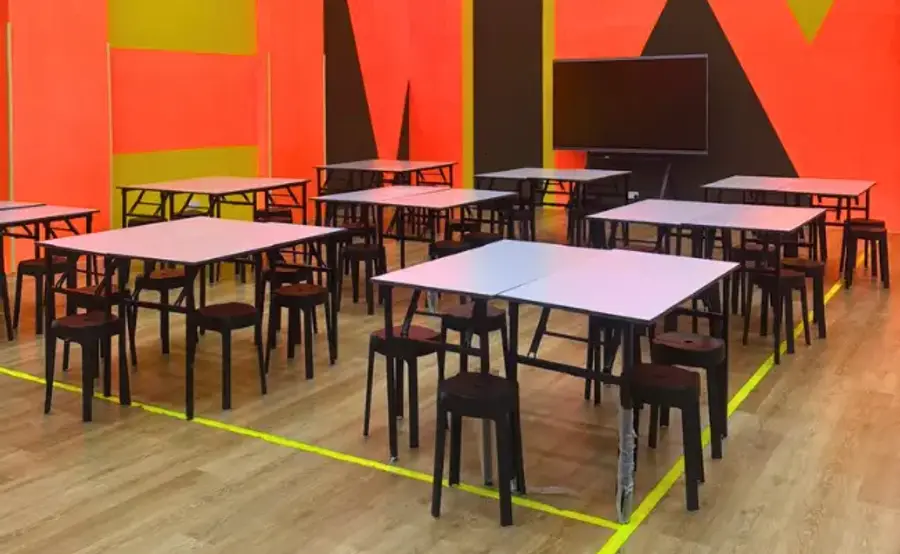 The FunEmpire workshop studio at Tai Seng, with worktables and stools set out