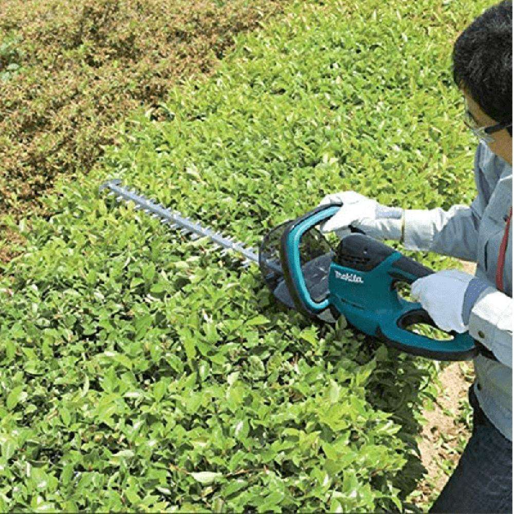 ماكينة تشذيب و قص التحويطات من ماكيتا (Makita) قياس (1/2") باستطاعة (670W) موديل (UH7580) 1