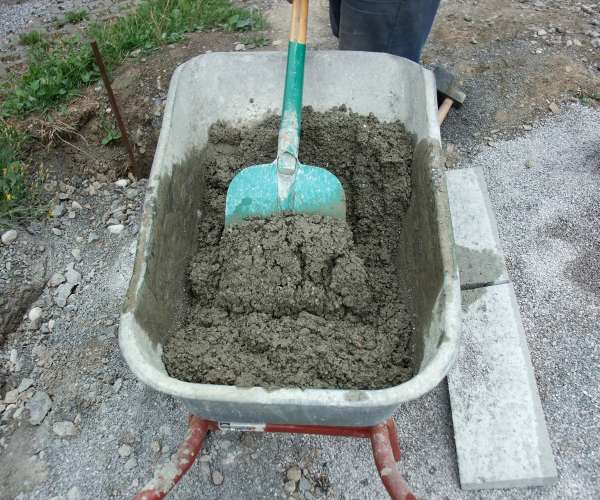 mix concrete in a wheelbarrow