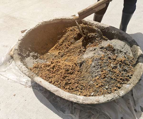 mixing concrete in a bucket