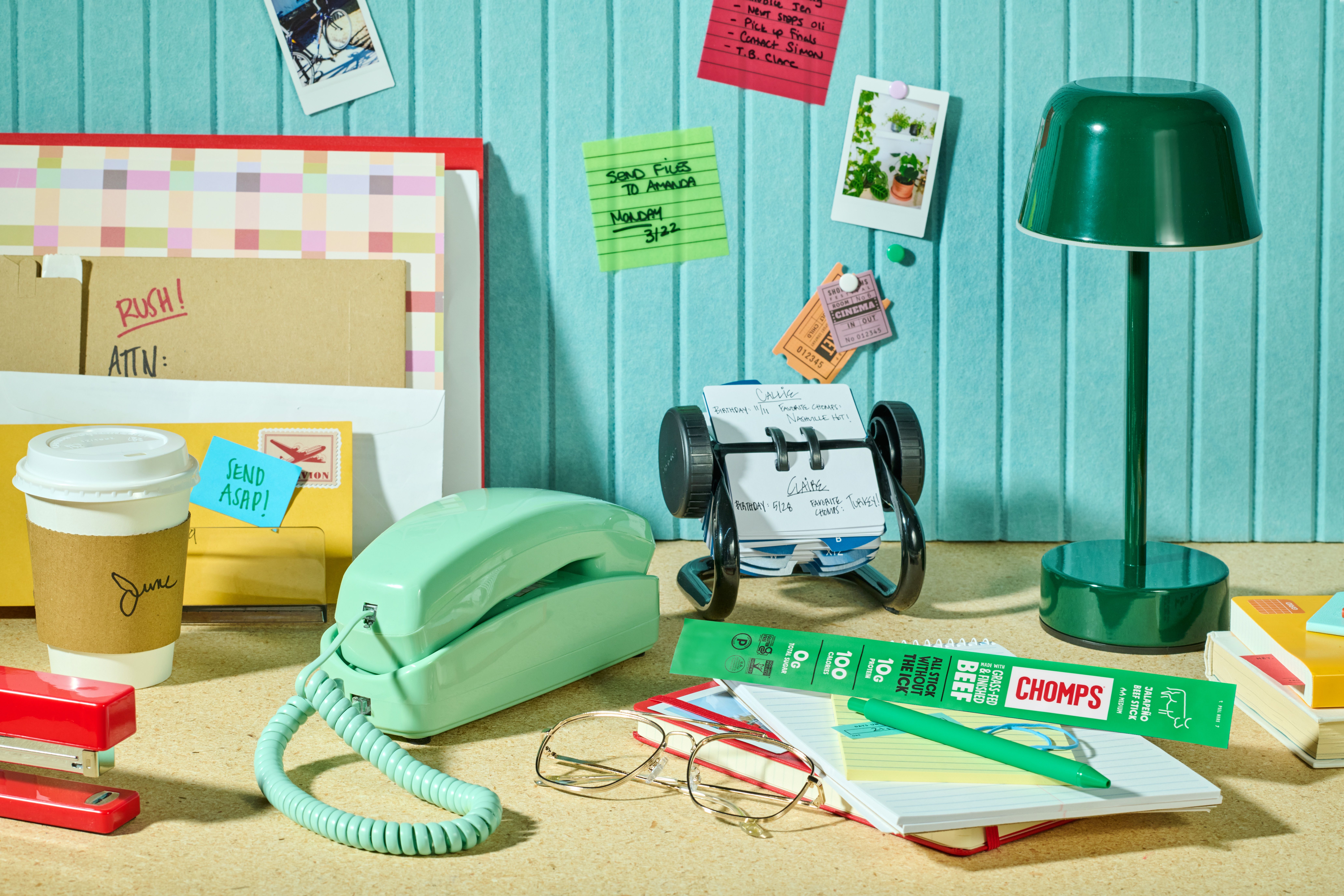 Chomps on a work desk among notes and office supplies