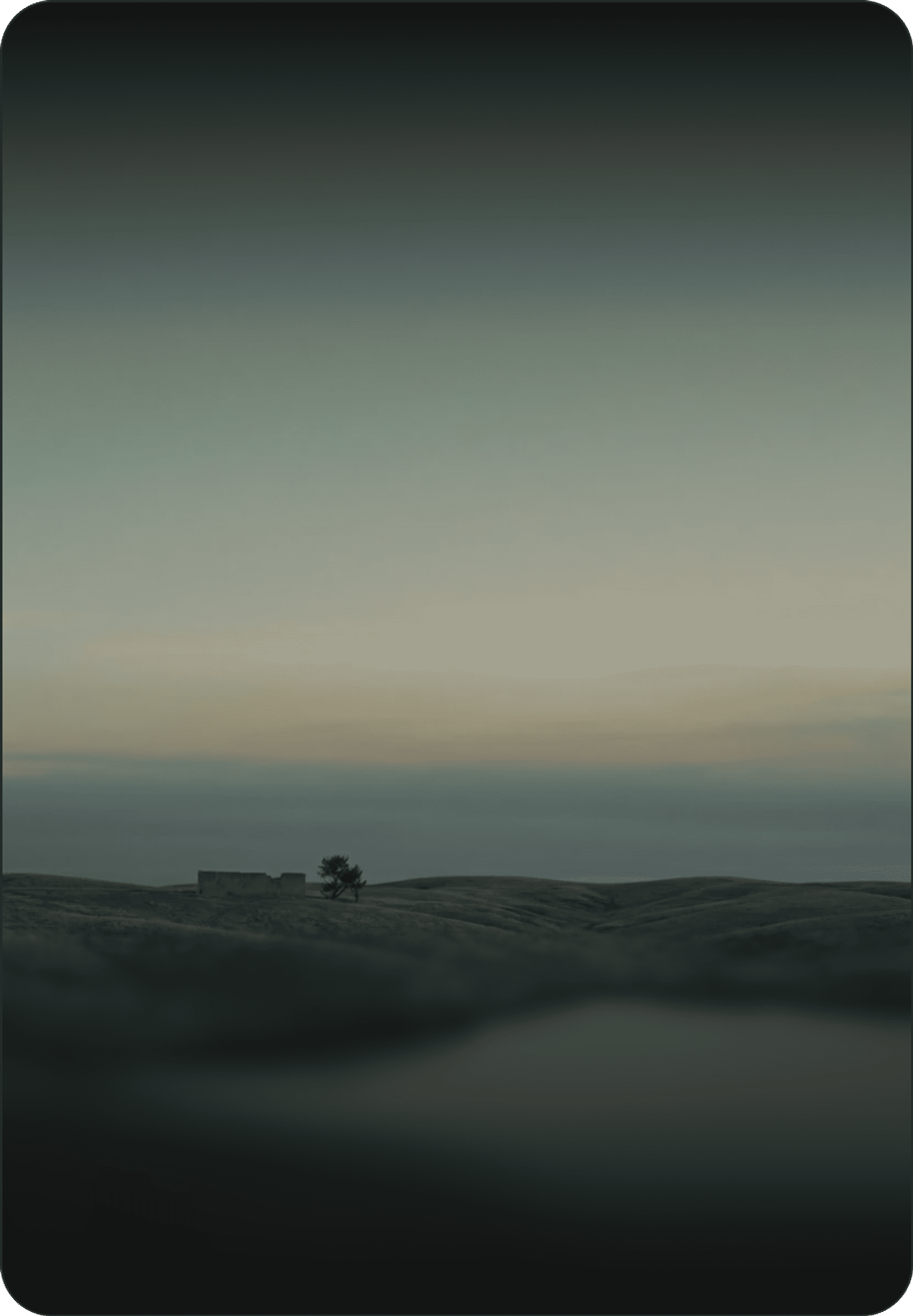 Calm pond among rolling grassy hills at dusk with a small ruin and lone tree under a pastel sky.
