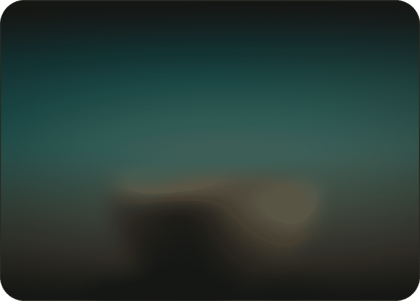 Blurred teal and green landscape at dusk.