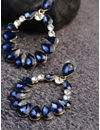 YouBella Navy Gold-Plated Stone-Studded Oval Drop Earrings