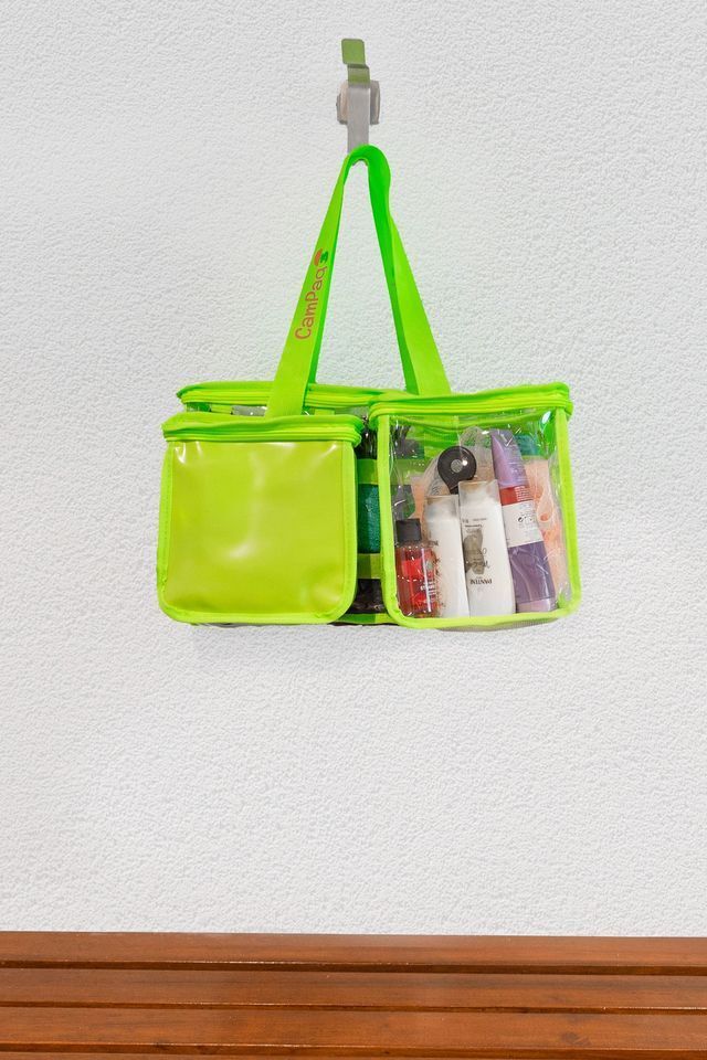 Transparent shower bag hanging on the wall in the shower amenities at a camping ground