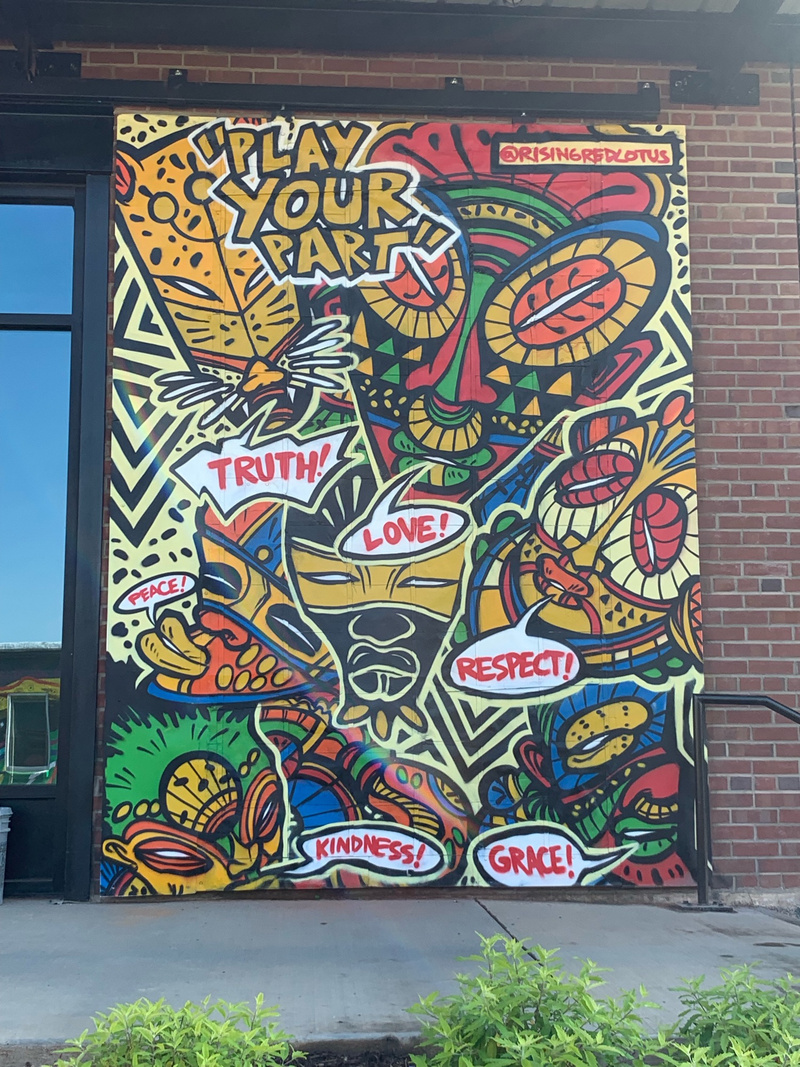 mural in Charlotte by artist rising red lotus.
