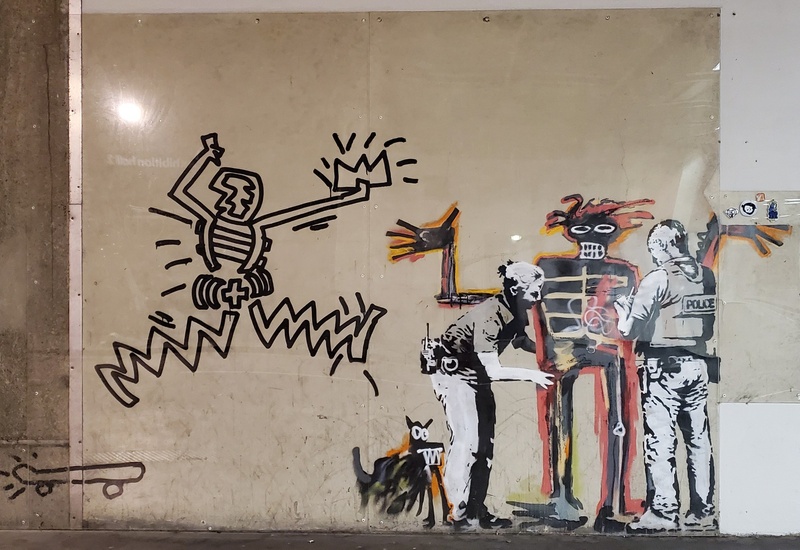 mural in by artist Banksy. Tagged: Jean-Michel Basquiat