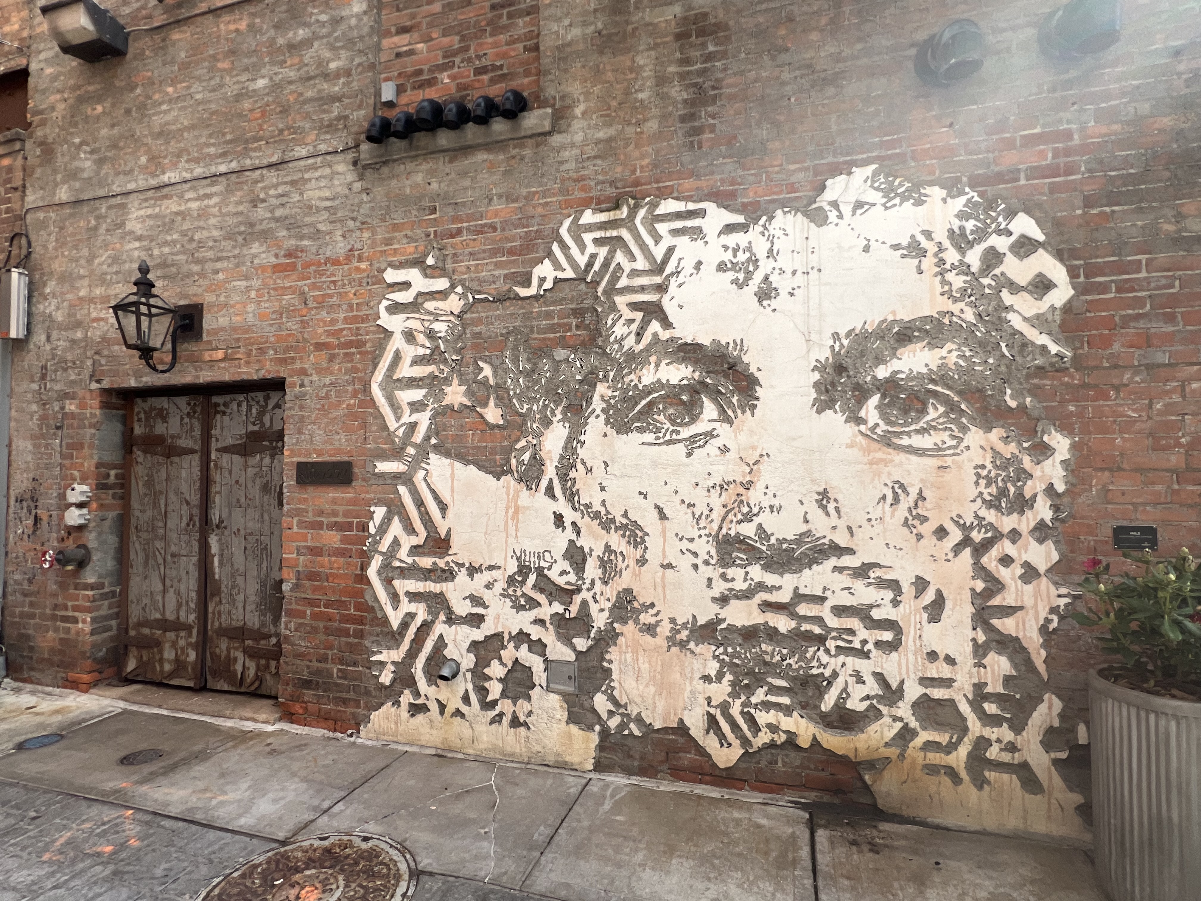mural in Detroit by artist Vhils.