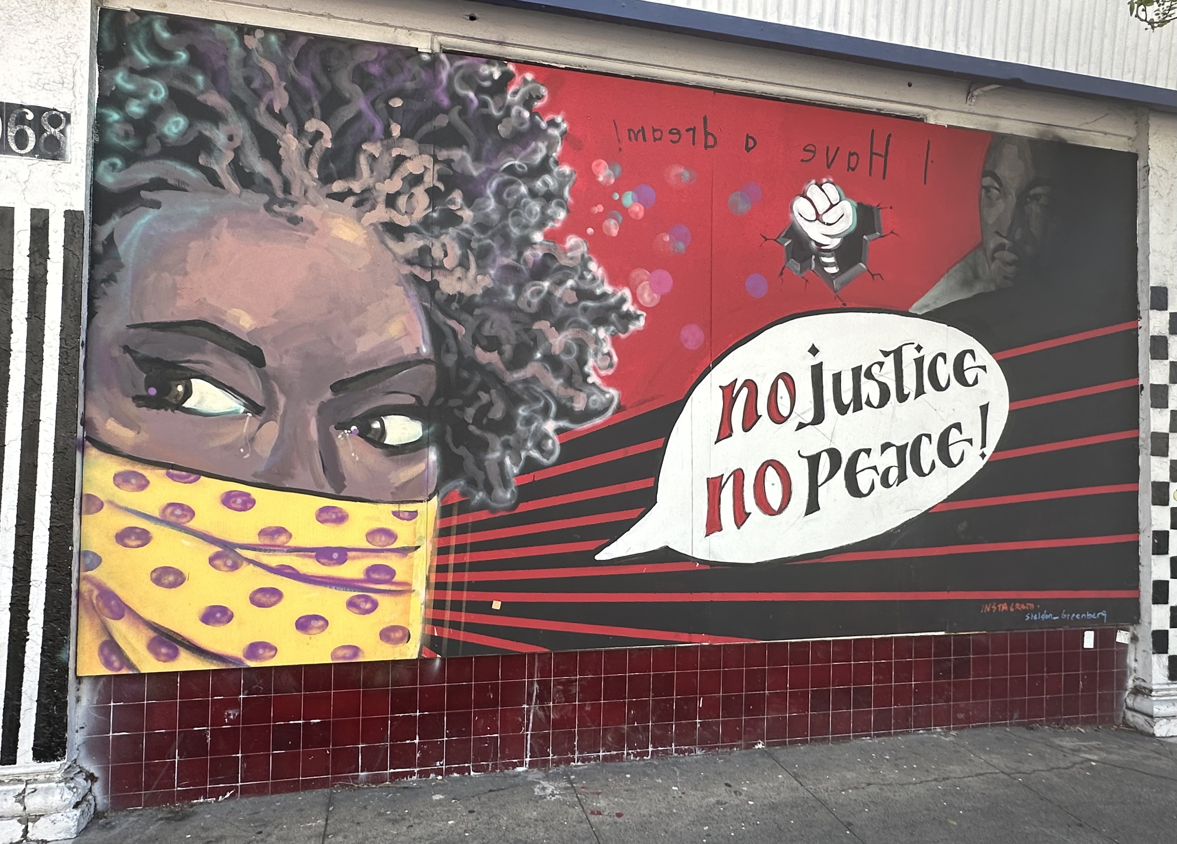 mural in Oakland by artist unknown.